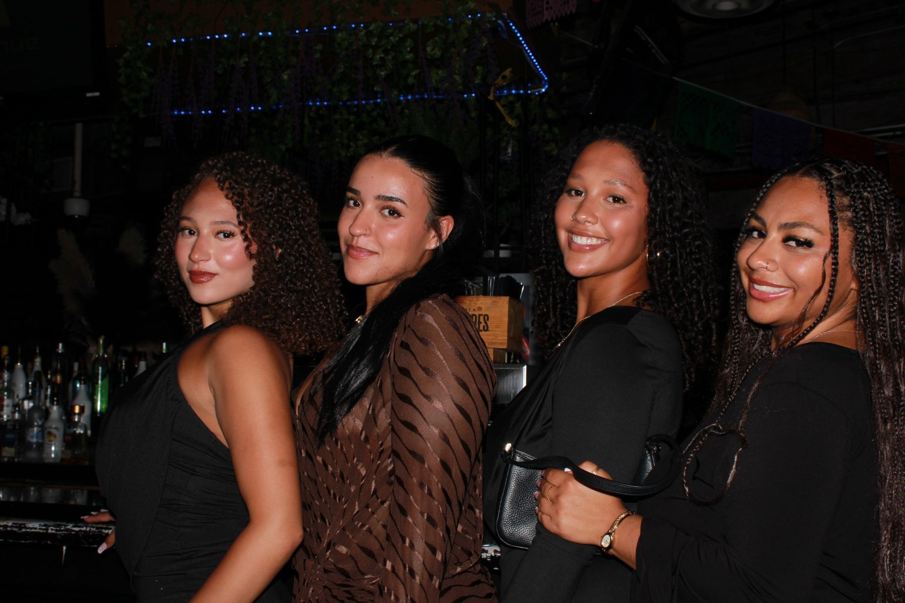 Guests connecting during a Visionary Society nightlife experience